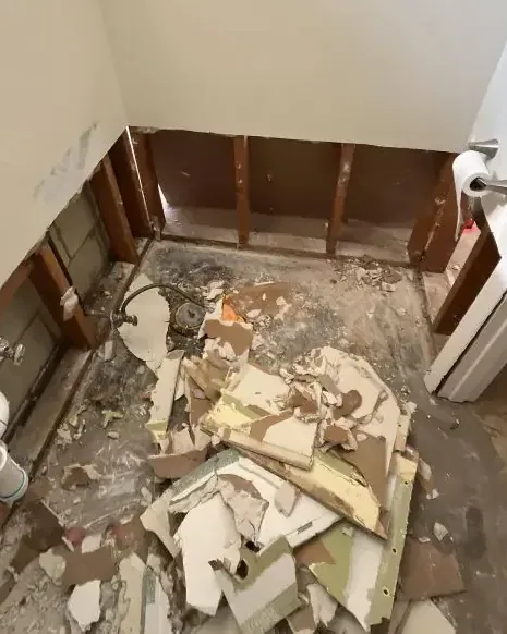 Bathroom stripped to the studs after a sewage backup cleanup