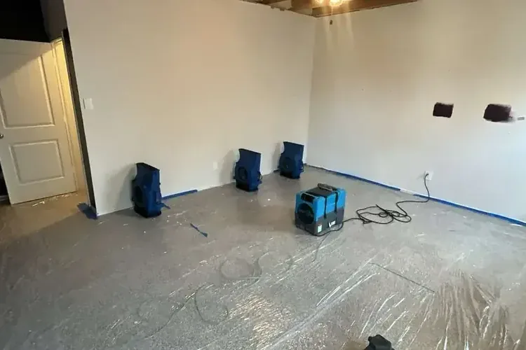 Opened ceiling exposing ductwork after an AC condensate overflow
